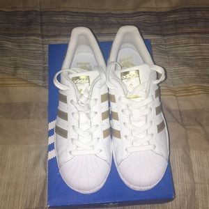Brand new gold adidas superstars